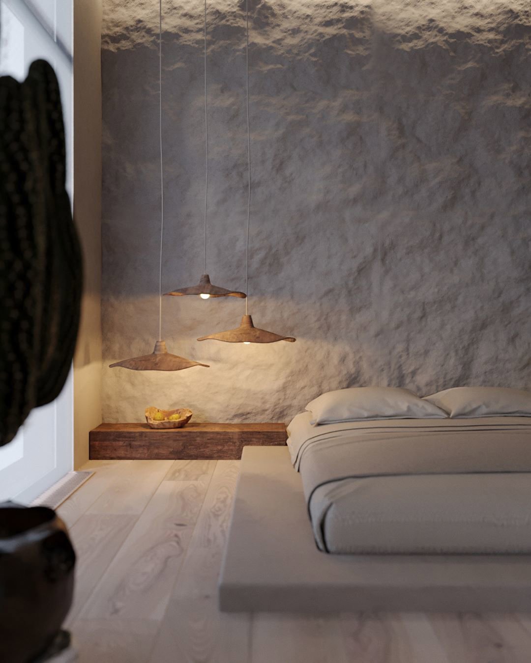 Dormitorio con paredes rugosas y lámparas suspendidas