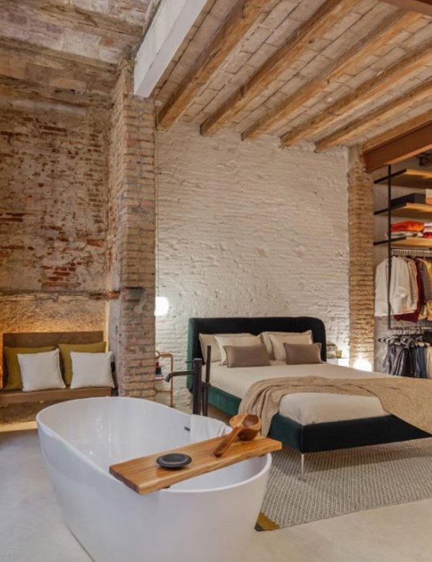 Dormitorios con paredes de ladrillo: una tendencia sin complejos de estilo